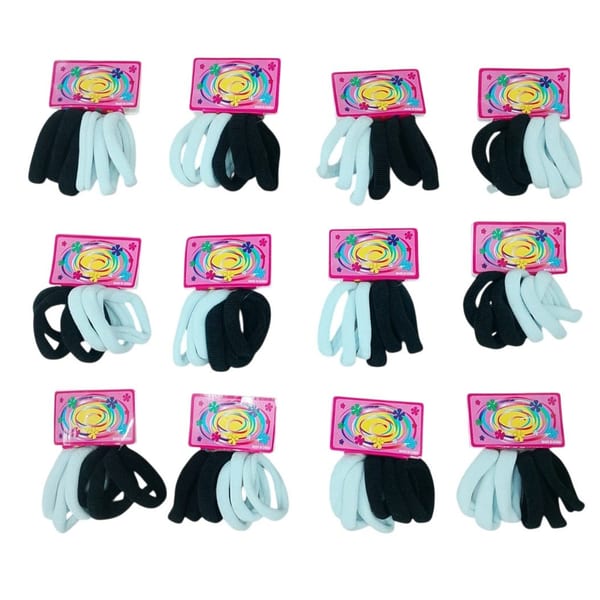 Docena de tarjetas con colitas de pelo elastizadas gruesas en colores blanco y negro.