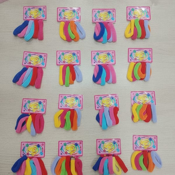 Docena de tarjetas con colitas de pelo elásticas en colores surtidos