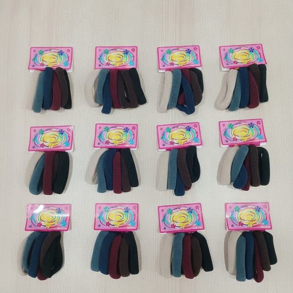 Docena de tarjetas con colitas para el pelo elastizadas morley en varios colores