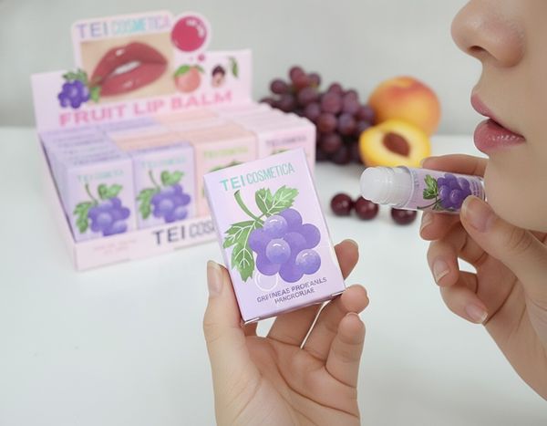 Caja exhibidora de bálsamos labiales frutales TEI Cosmética x24 unidades