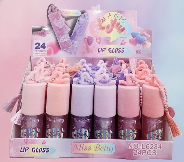 Caja exhibidora con 24 brillos labiales Miss Betty Magic Love con detalles de borlas