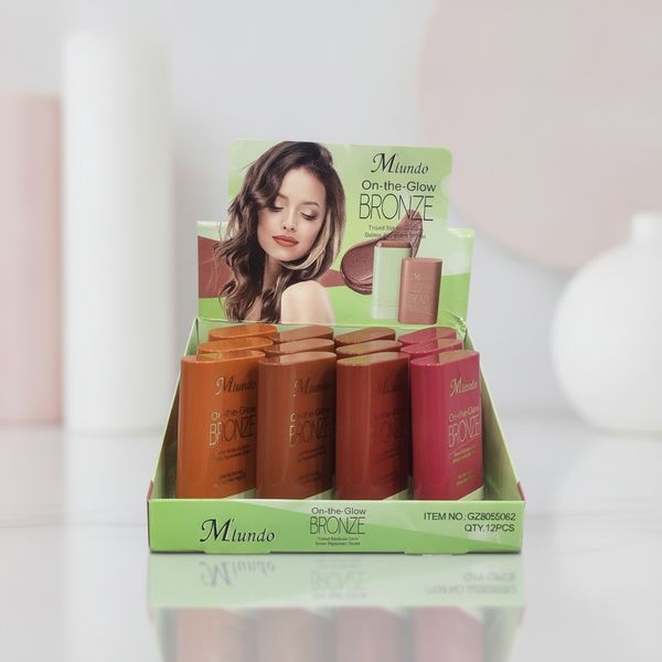 Caja exhibidora de bronceadores en barra Mlundo On-the-Glow Bronze