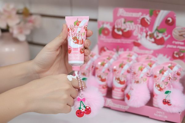 Caja exhibidora de cremas para manos Rimocoo Cherry con pompones rosados