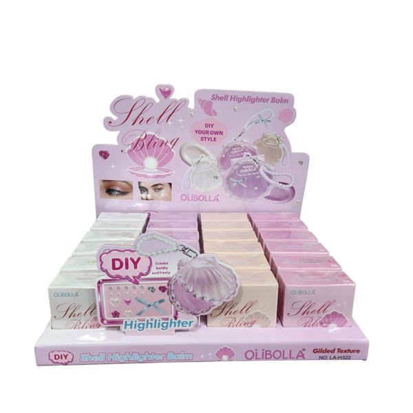 Exhibidor con cajas de iluminador en bálsamo marca OliBolla Shell Bling en forma de caracola