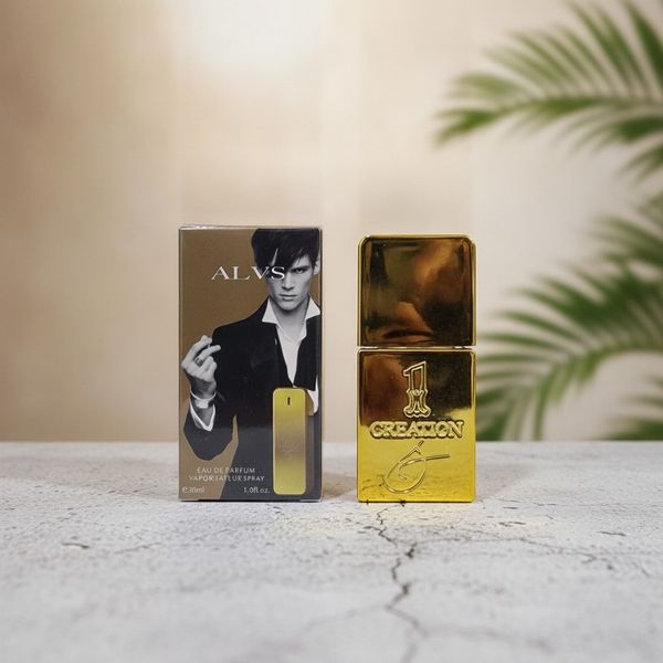 Perfume ALVS 1 Creation 30ml dorado junto a su caja de presentación