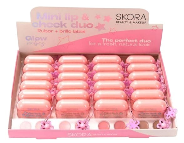 Caja exhibidora de duos de rubor y brillo labial Skora en cápsulas rosadas
