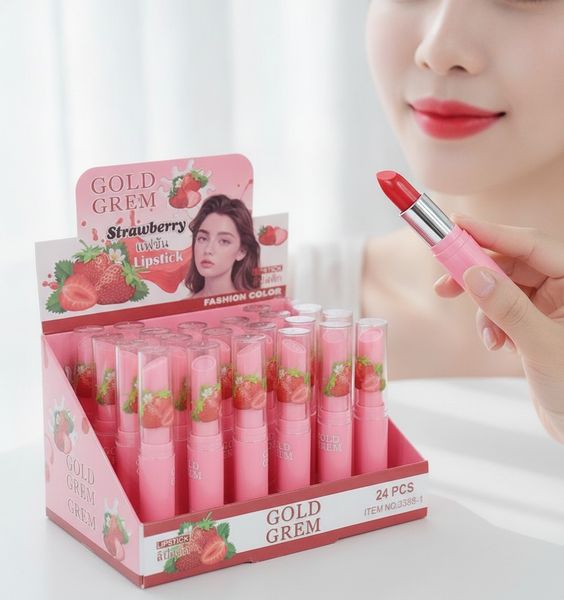 Caja exhibidora de 24 labiales rosas con gráfico de frutilla marca Gold Grem